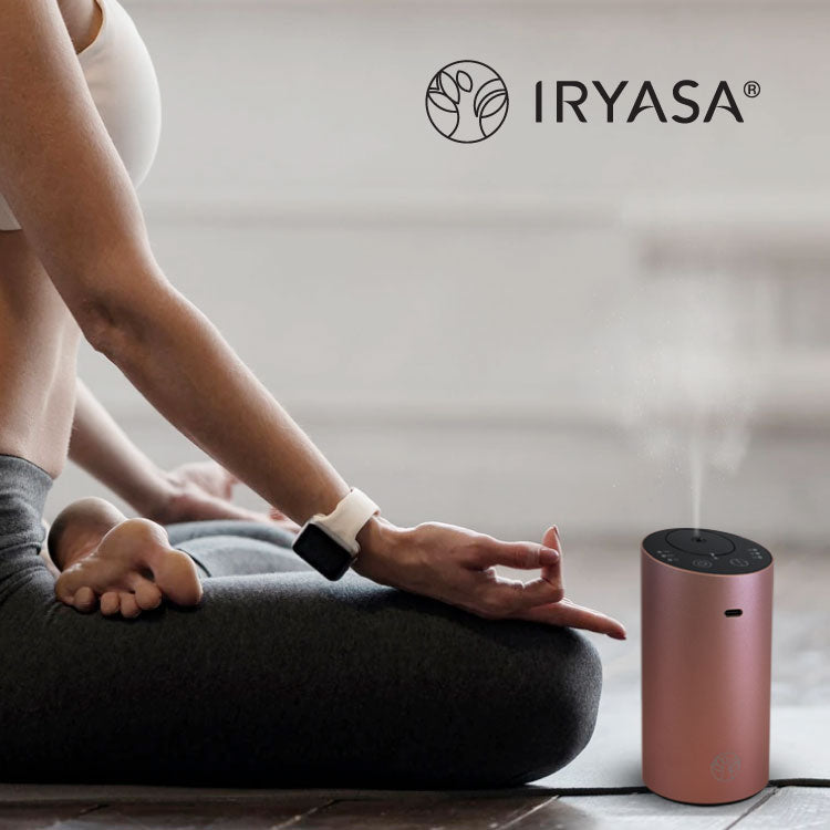 Aromatherapy Essential Oil Diffuser next to a person doing yoga